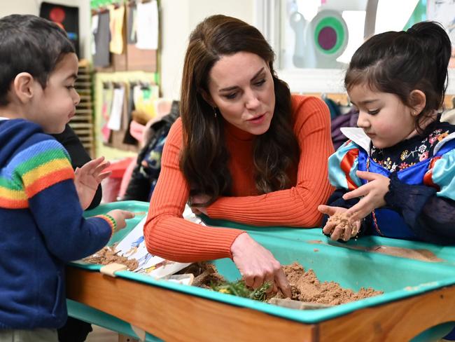 Catherine, Princess of Wales interacts with children playing in a sandpit. Picture: Getty Images