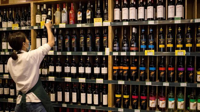 An employee at a wine store selling Australian-made wine in Beijing. Picture: Noel Celis/AFP