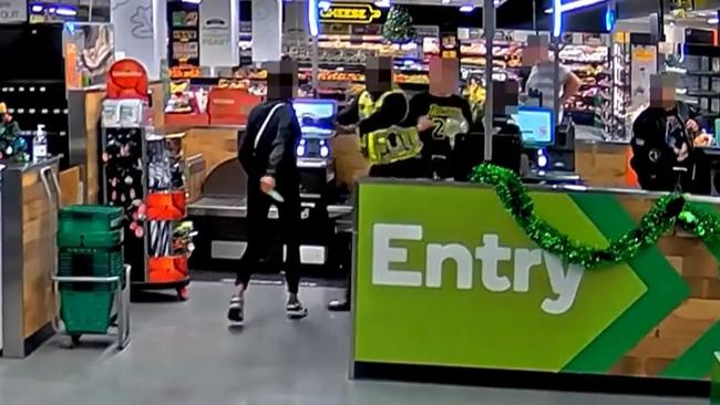 Newly released footage also shows a customer threatening to shiv security workers at a Woolworths self-checkout. Picture: Supplied.