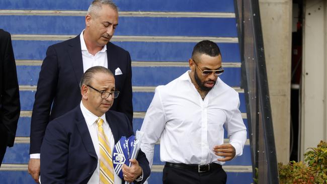 Former Canterbury winger Josh Addo-Carr leaving Belmore Sports Ground with his lawyer Elias Tabchouri (left) and manager Mario Tartak (back) after a meeting with the Bulldogs board. Picture: Jonathan Ng