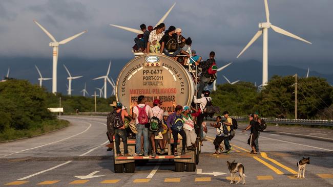 Migrants catch a ride in Oaxaca, Mexico, yesterday. Picture: AFP