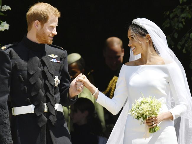 Britain's Prince Harry and Meghan, Duchess of Sussex, stand on the steps of St. George's Chapel in Windsor Castle in Windsor, near London. Picture: AP