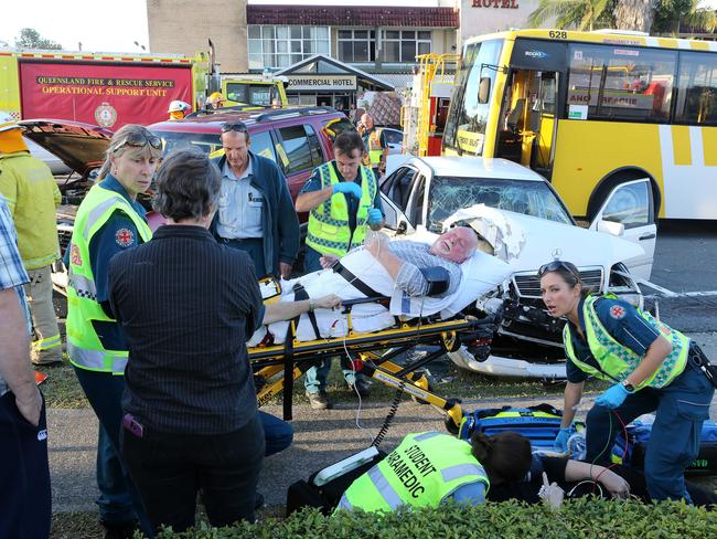 Three car and bus accident at corner of Ferry  and Price St at Nerang.Emergency services treat the injured at the scene . Picture Glenn Hampson