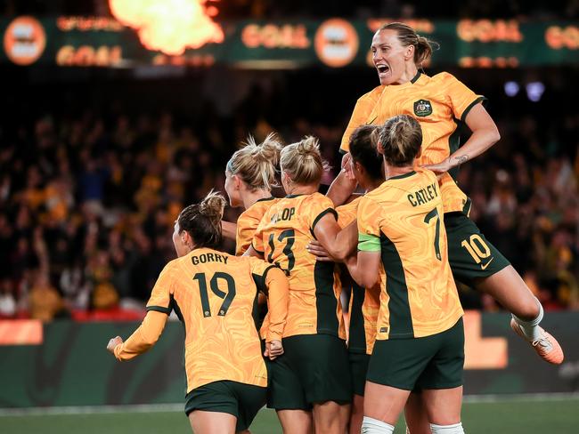 MELBOURNE, AUSTRALIA - JULY 14: Mary Fowler of Australia celebrates after scoring her team's first goal with teammates during the International Friendly match between the Australia Matildas and France at Marvel Stadium on July 14, 2023 in Melbourne, Australia. (Photo by Andrew Wiseman/DeFodi Images via Getty Images)