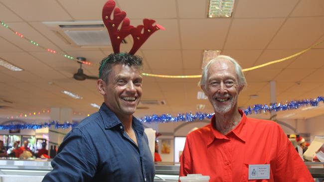 Spreading cheer and serving drinks were David Bullock and Ron Baldwin at the 2022 Cairns Community Christmas Lunch. Picture: Alison Paterson