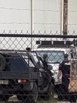 Police at the Portsmith yard where the True North LandCruiser was located.