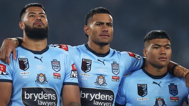 Stephen Crichton, centre, had a nervous night on the bench before getting on the field in the 52nd minute in Origin I. Picture: Mark Kolbe/Getty Images