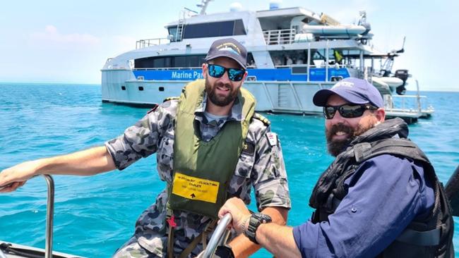 Australia Defence Vessel Cape Inscription Navigation Officer Lieutenant Rhys Worboys and Great Barrier Reef Marine Park Authority officer Dwaine Butcher in front of Reef Ranger, a Queensland Parks and Wildlife Service vessel. Picture: Contributed