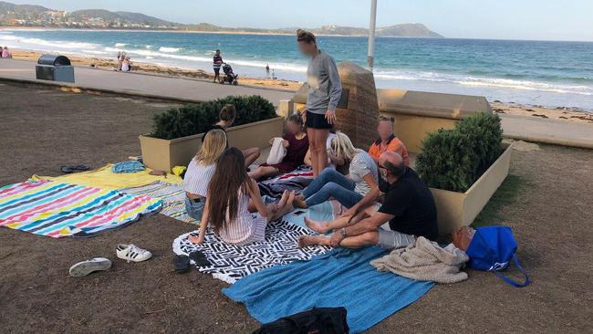 People using the Terrigal War Memorial as a windbreak, which has angered veterans. Picture: supplied.