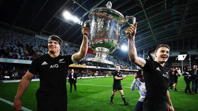 Scott Barrett and Beauden Barrett of the All Blacks celebrate with the Bledisloe Cup after winning The Rugby Championship Bledisloe Cup match between the New Zealand All Blacks and the Australia Wallabies in Dunedin, New Zealand. Picture: Getty