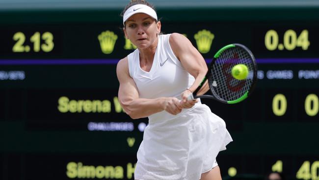 Romania's Simona Halep powers to victory against Serena Williams in the Wimbledon final. Picture: Ben Curtis / AFP