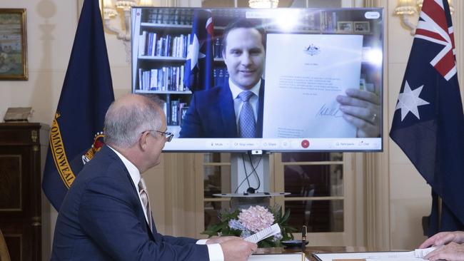 Alex Hawke is sworn in by Prime Minister Scott Morrison early on in the pandemic. Picture: NCA NewsWire / Gary Ramage