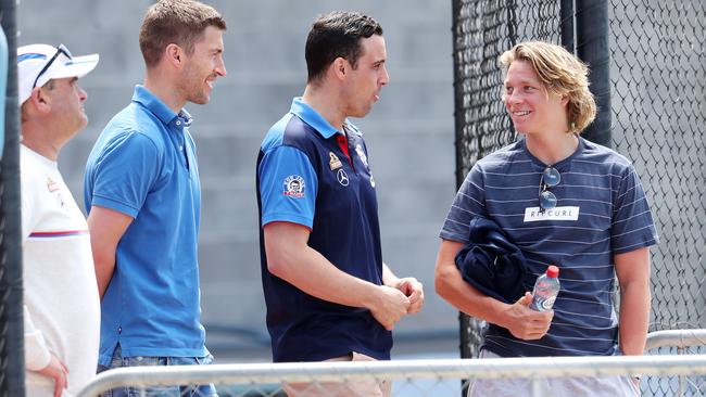 Draft prospect Cody Weightman (right) is shown around the Whitten Oval by Western Bulldogs list manager Sam Power, national recruiting manager Nick Austin and football manager Chris Maple. Picture: Michael Klein