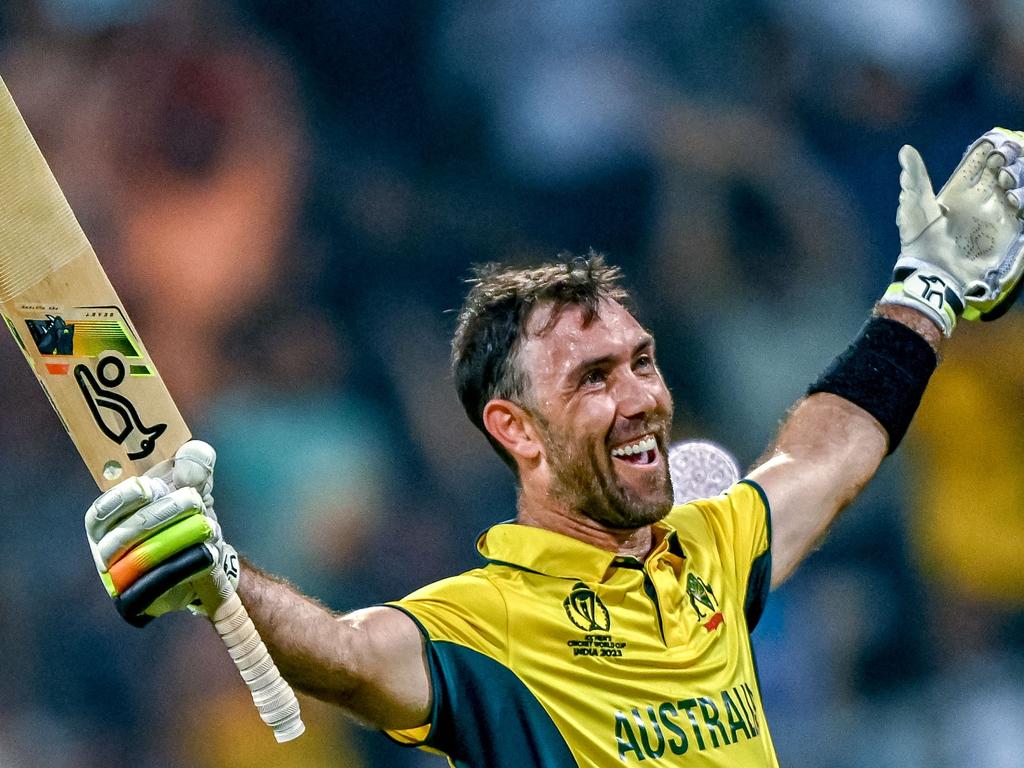 Australia's Glenn Maxwell celebrates after winning the 2023 ICC Men's Cricket World Cup one-day international (ODI) match between Australia and Afghanistan at the Wankhede Stadium in Mumbai on November 7, 2023. (Photo by INDRANIL MUKHERJEE / AFP) / -- IMAGE RESTRICTED TO EDITORIAL USE - STRICTLY NO COMMERCIAL USE --