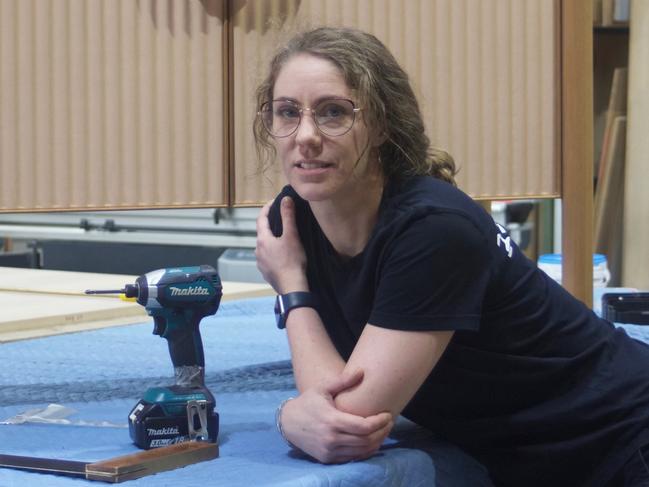 Jessica Currie is a qualifed cabinet maker and joiner after completing an apprenticeship and TAFE course in 2022. New data has revealed more students are graduating courses at Victorian TAFEs compared to students completing university nationally. Picture: Supplied