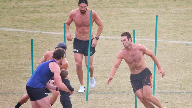 Jobe Watson (right) training with teammates at St Bernard’s College. Picture: Hamish Blair