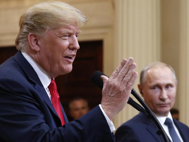 U.S. President Donald Trump speaks with Russian President Vladimir Putin during a press conference after their meeting at the Presidential Palace in Helsinki, Finland, Monday, July 16, 2018. (AP Photo/Pablo Martinez Monsivais)