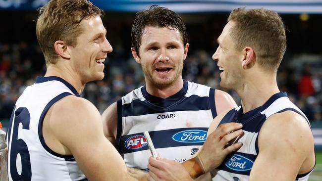 Patrick Dangerfield celebrates Geelong’s win with Scott (left) and Joel Selwood. Picture: Getty Images