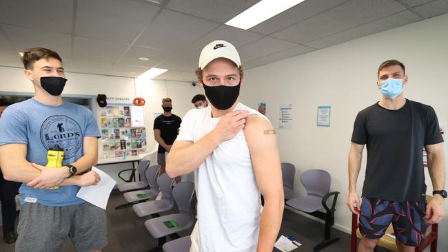 Cooper Sharman, Jack Billings and Mason Wood after their jab. Picture: David Caird