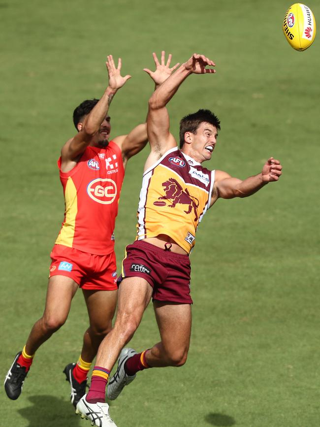 Former Suns midfielder Jarryd Lyons (right) in action for Brisbane. Picture: Getty Images