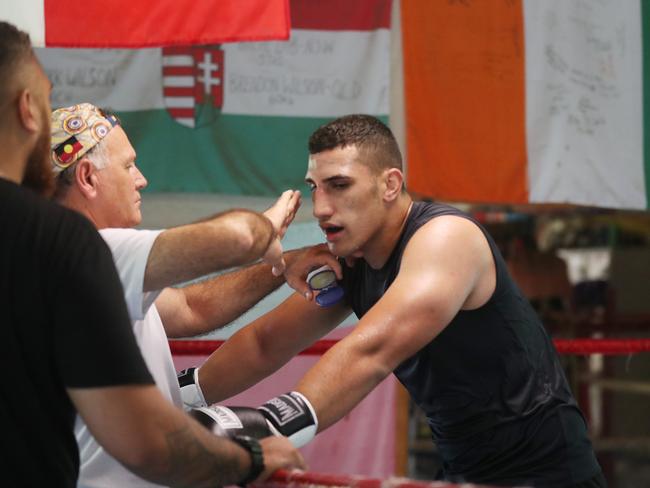 Olympic boxer Justis Huni and coach Mark Wilson. Picture: Annette Dew