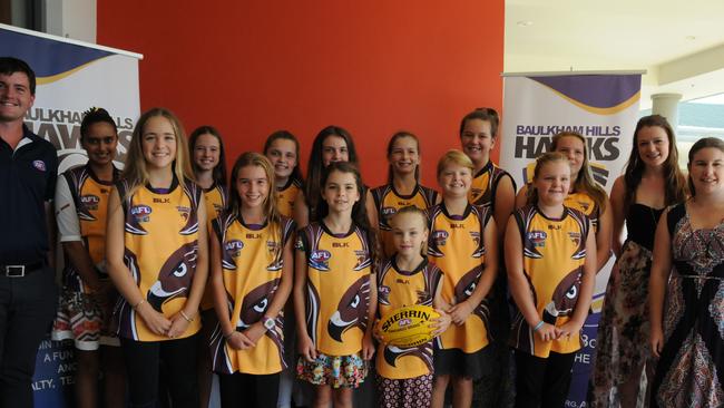 The Baulkham Hills Hawks Youth Girls with AFL NSW/ACT's Matthew Mack and coaches Aislinn Millett and Jana Webb at the season launch on March 19.