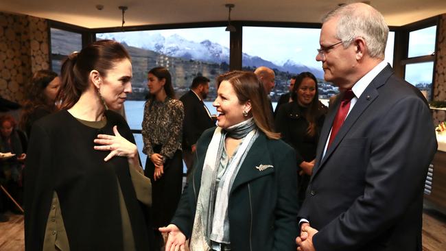 Scott and Jenny Morrison with Jacinda Ardern, left, in Queenstown, New Zealand, on Sunday. Picture: Adam Taylor