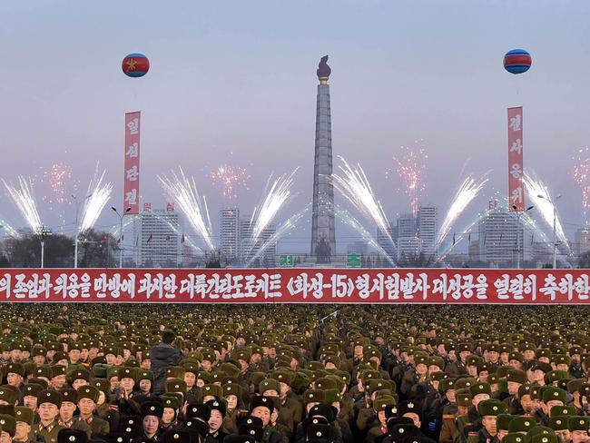 North Korean soldiers and Pyongyang residents holding a rally to celebrate the North's declaration on November 29 it had achieved full nuclear statehood. Picture: AFP