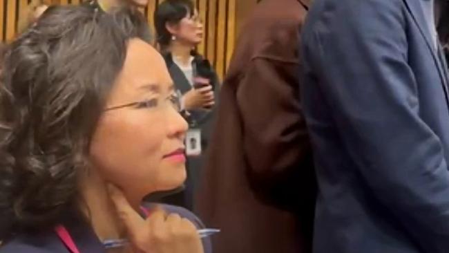 Cheng Lei is obstructed by Chinese officials at a press conference in Canberra on Monday. Picture: The Daily Telegraph