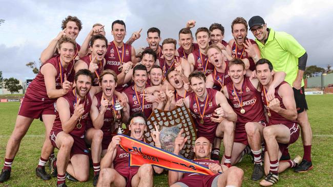 Prince Alfred Old Collegians celebrate after winning the Adelaide Footy League division one grand final against Payneham Norwood Union at Richmond Oval. Picture: Brenton Edwards