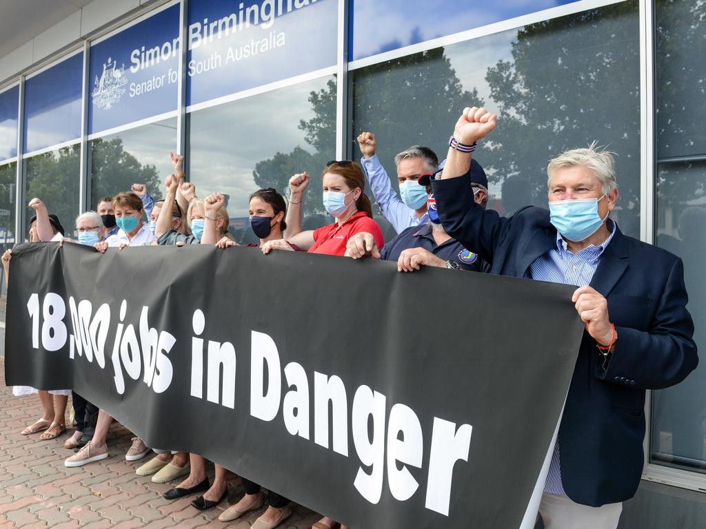 A small group of travel agents protesting outside the office of South Australian Senator Simon Birmingham on Tuesday. Picture: Brenton Edwards