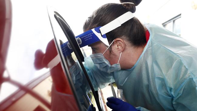 Face shields can no longer be worn without a mask. Picture: Darrian Traynor/Getty Images