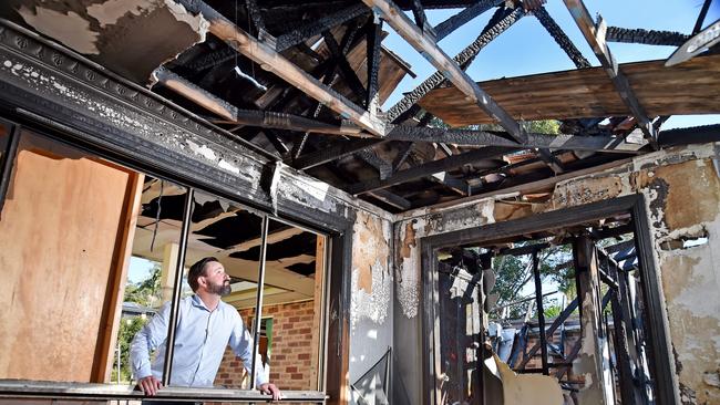 Mr Martin at the burnt-out property. Picture: Troy Snook.