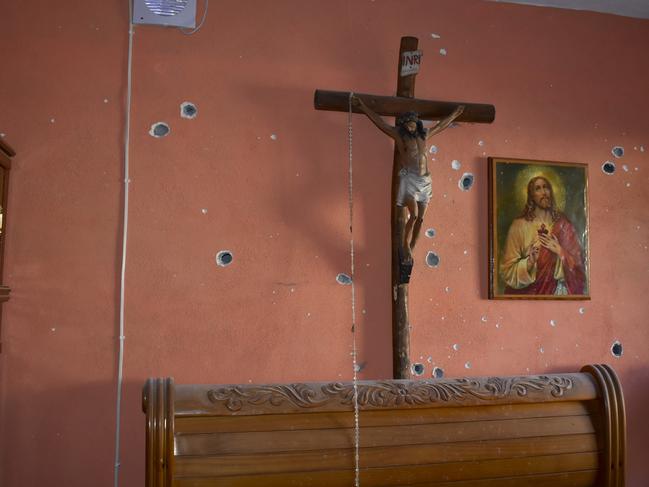 A wall of the room of a home is riddled with bullet holes after a gunbattle between Mexican security forces and suspected cartel gunmen, in Villa Union, Mexico. Picture: AP Photo