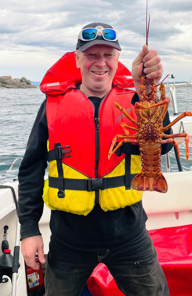 Lorne McAulay seems happy with his Southern Rock Lobster capture.