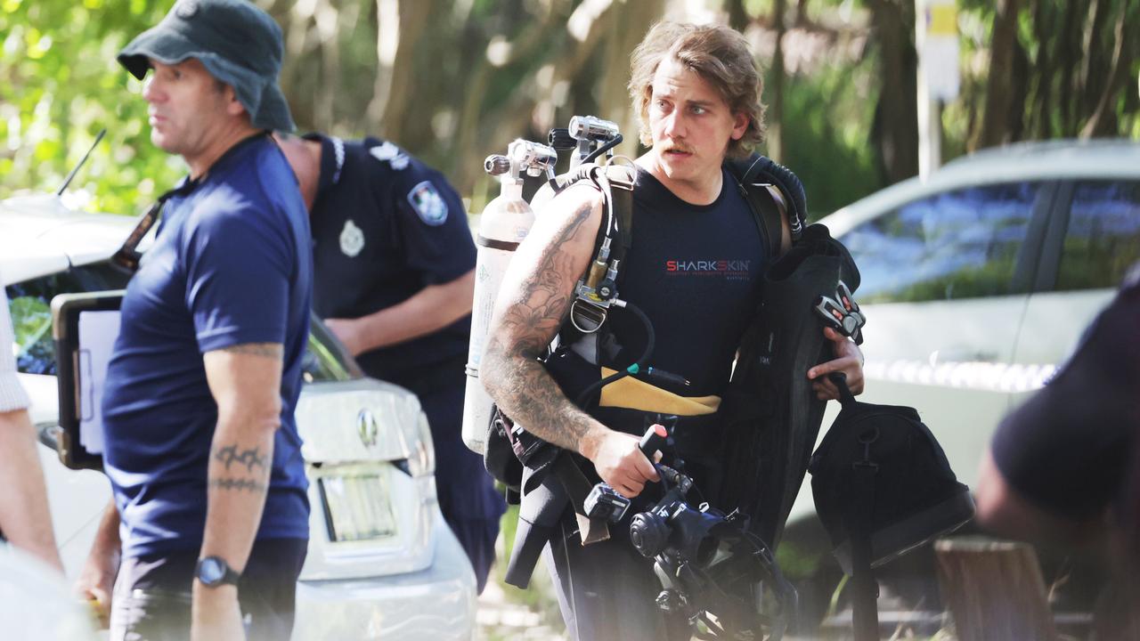 Police dive crews at the scene of the alleged fatal attack of an 87-year-old man at Noosa Heads on Sunday morning. Picture Lachie Millard