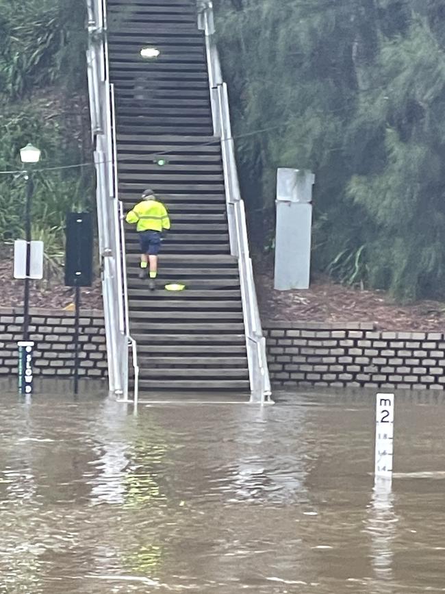 A man walks up the steps leading to Stewart St, Parramatta, after inspecting the banks of the Parramatta River flooding. Picture: Joanne Vella