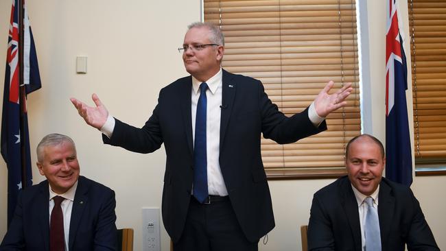 Prime Minister Scott Morrison addresses government MPs during a Coalition party room meeting at Parliament House in Canberra.