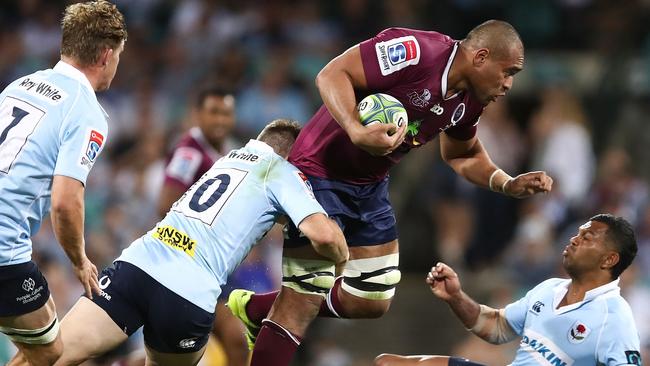 SYDNEY, AUSTRALIA - APRIL 14:  Lukhan Tui of the Reds is tackled by the Waratahs defence during the round nine Super Rugby match between the Waratahs and the Reds at Sydney Cricket Ground on April 14, 2018 in Sydney, Australia.  (Photo by Brendon Thorne/Getty Images)