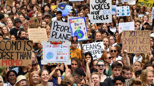 School children shout slogans during a protest to address climate change in Sydney in March. Picture: Saeed Khan / AFP