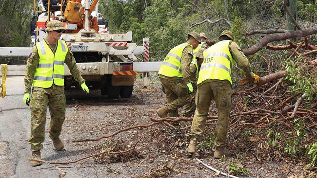 Soldiers getting stuck in to the clean-up effort in the Gold Cost hinterland. Picture: Adam Head