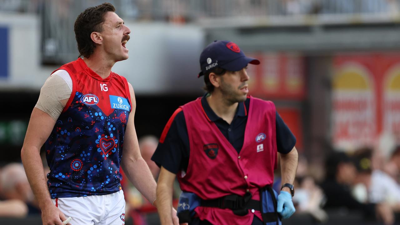 Melbourne star Jake Lever (left) briefly left training on Tuesday but returned to the field shortly after as he tries to return from a knee injury on Friday night. Picture: Will Russell / Getty Images