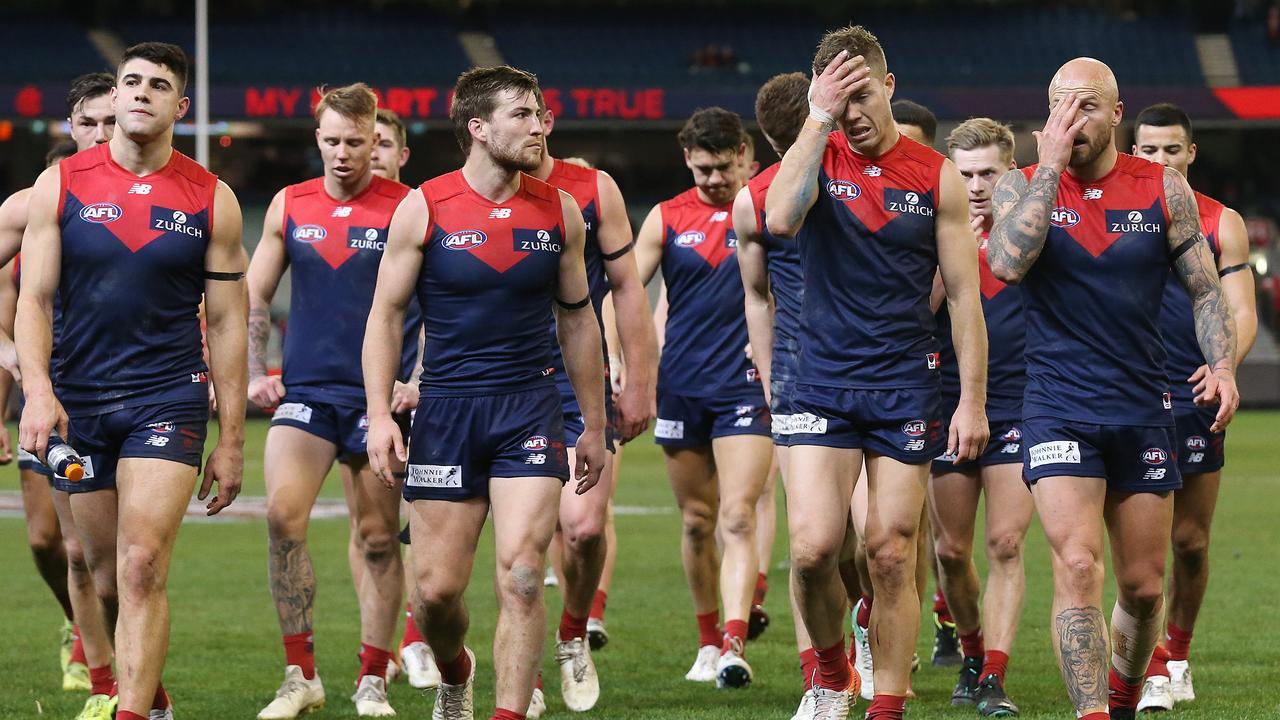 A disappointed Melbourne outfit trudge off the MCG. Pic: Michael Klein