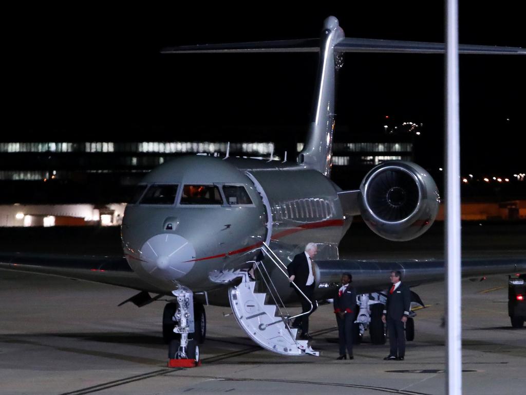 Julian Assange disembarks the plane that has brought him home to Australia. Picture: Getty Images