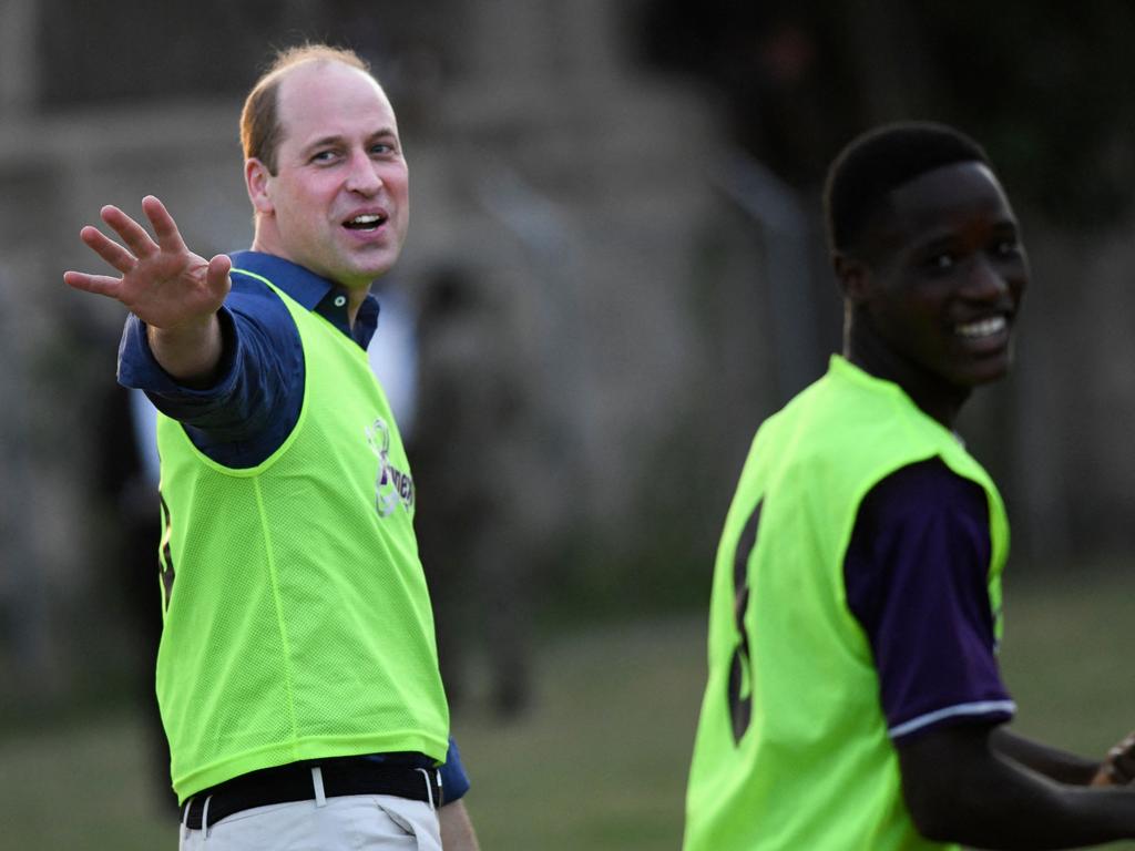 Prince William plays soccer with players from Kingston College. Picture: AFP