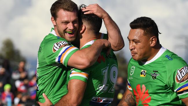 Michael Oldfield of the Raiders is congratulated by teammate Ryan Sutton after scoring the opening try during the Round 8 NRL match between the Canberra Raiders and the Penrith Panthers at McDonald Park in Wagga Wagga, Saturday, May 4, 2019. (AAP Image/Dean Lewins)