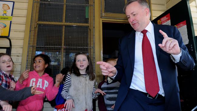 Member for Granydler Anthony Albanese “shakes it off” with some kids at Annandale Public School on election day. Mr Albanese busted out some “DJ Albo” at the polling station. Picture: AAP