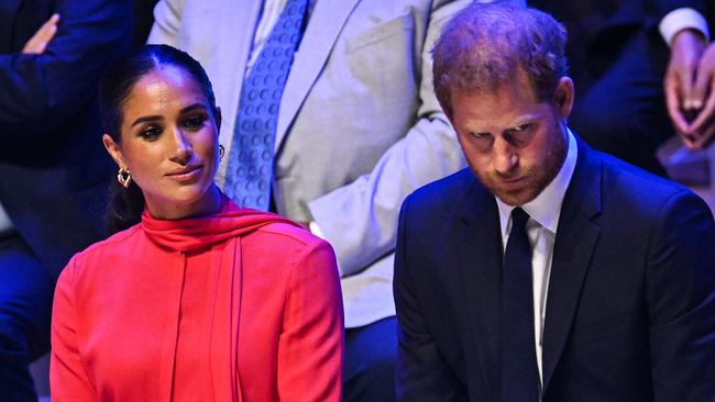 (FILES) In this file photo taken on September 5, 2022 Britain's Meghan, Duchess of Sussex and Britain's Prince Harry, Duke of Sussex, react as they attend the annual One Young World Summit at Bridgewater Hall in Manchester, northwest England. - Prince Harry and his wife Meghan are being evicted from their home on the British royal family's Windsor estate, leaving them without a UK base, reports said on March 1, 2023. Frogmore Cottage, which they refurbished at a reported cost of Â£2.4 million ($2.9 million), had been a wedding present from the late Queen Elizabeth II in 2018. It has now been offered to Prince Andrew, King Charles III's disgraced brother, reports in The Sun and Daily Telegraph said. (Photo by Oli SCARFF / AFP)