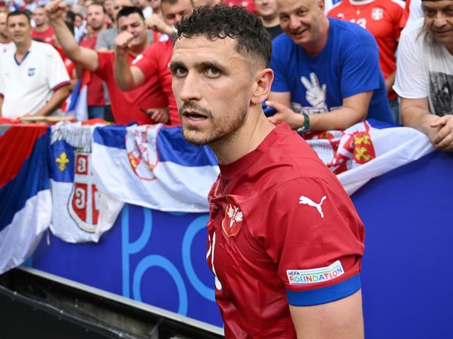 MUNICH, GERMANY - JUNE 20: Milos Veljkovic of Serbia looks on after interacting with fans prior to the UEFA EURO 2024 group stage match between Slovenia and Serbia at Munich Football Arena on June 20, 2024 in Munich, Germany. (Photo by Clive Mason/Getty Images)