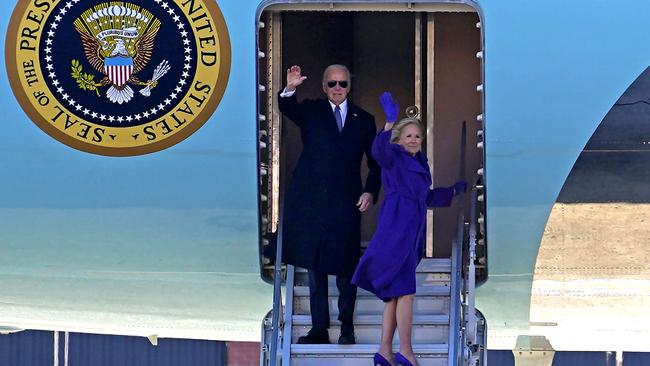 Former president Joe Biden and former first lady Jill Biden wave as they board Air Force One during a farewell ceremony on January 20, following Donald Trump's inauguration. Picture: AFP